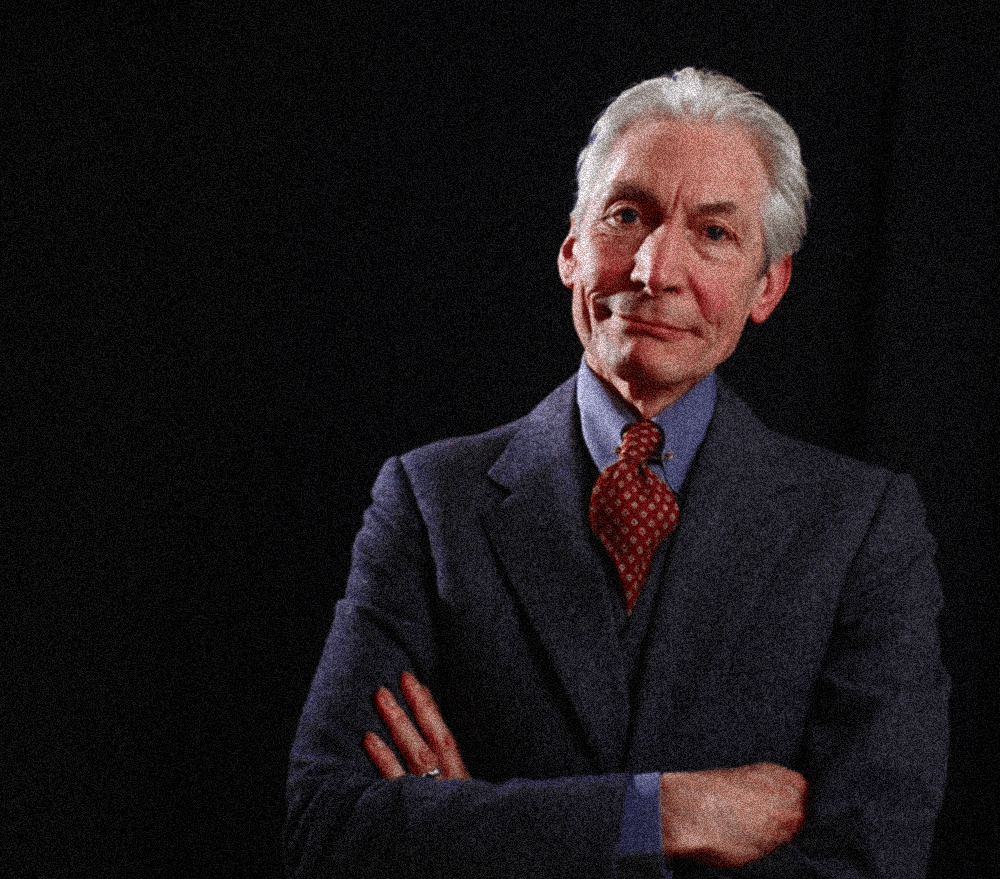 Charlie Watts, smiling, dancing and drumming in the rear wit the Rolling Stones 3 charlie watts as on seen on rolling stone.com